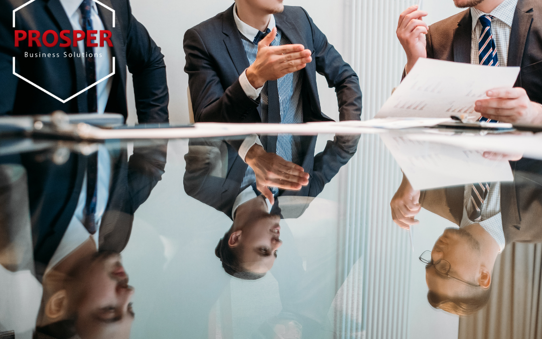 Three business men consulting on common business management challenges.